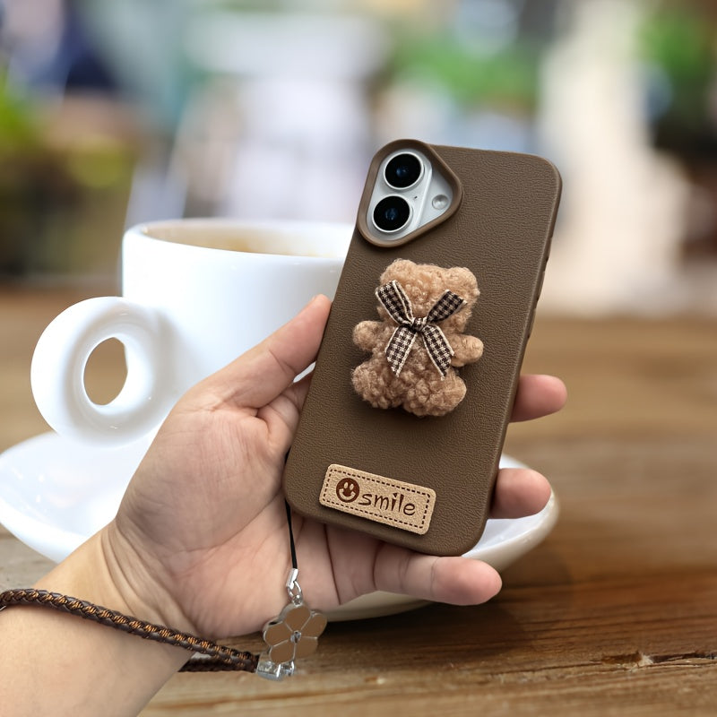 A Single-Pack Plush Teddy Bear Phone Case with a Bow, Available in White And Brown. It Comes with a Wrist Strap And Features a Simple And Elegant Faux Leather Texture That Is Anti-Slip And Fingerprint-Resistant. Made with TPU